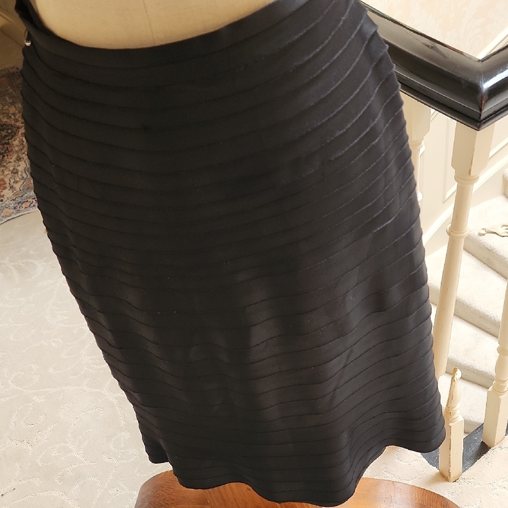 JS Collections Black Pencil Skirt With Flair At Bottom.